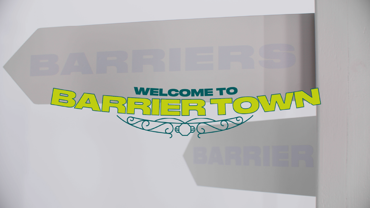 Signpost says, 'Welcome to Barrier Town.'